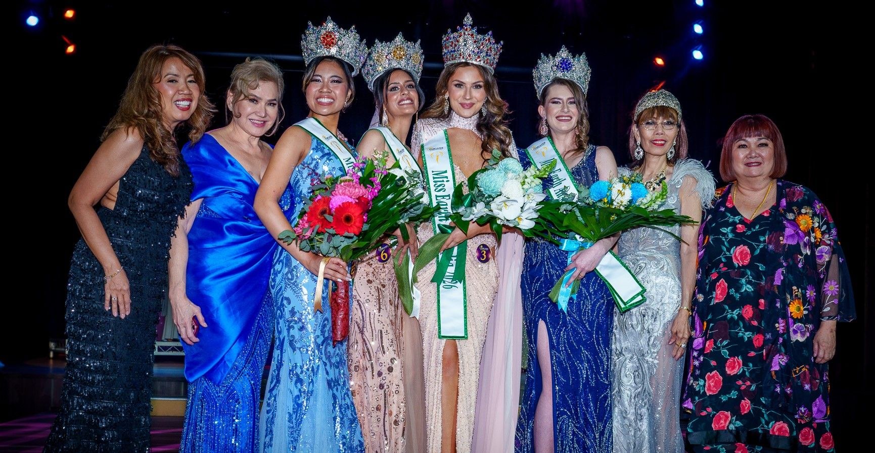 The Miss Earth Australia titleholders and the Stargazer team celebrating together on stage